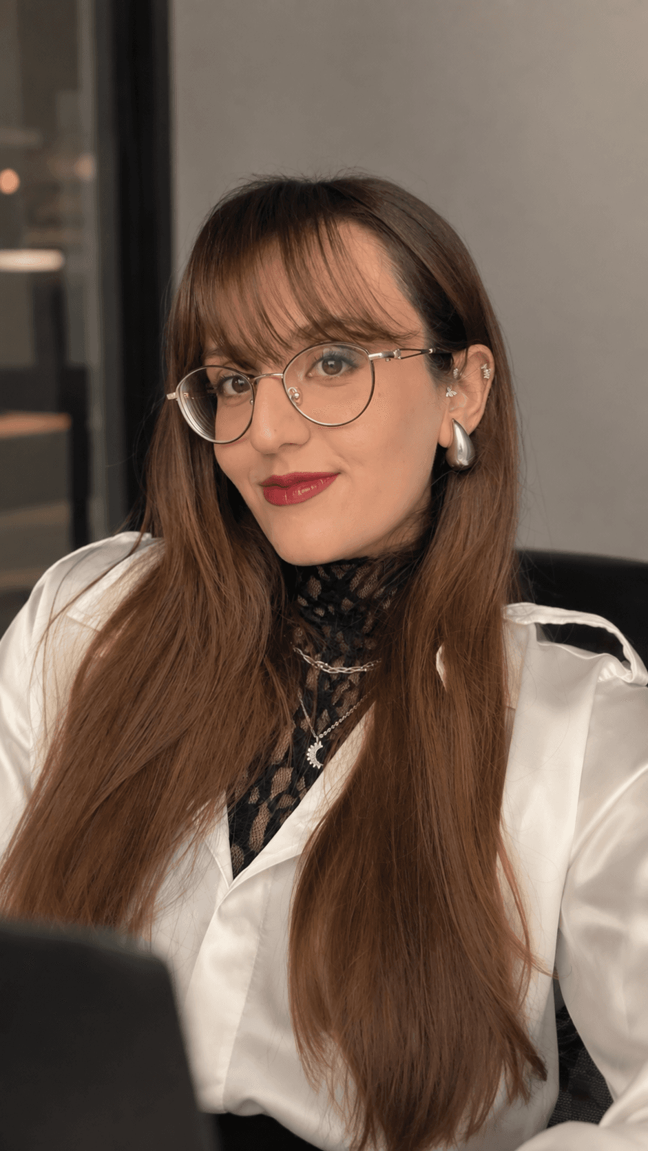Beyza Nur Koşar, seated at a laptop