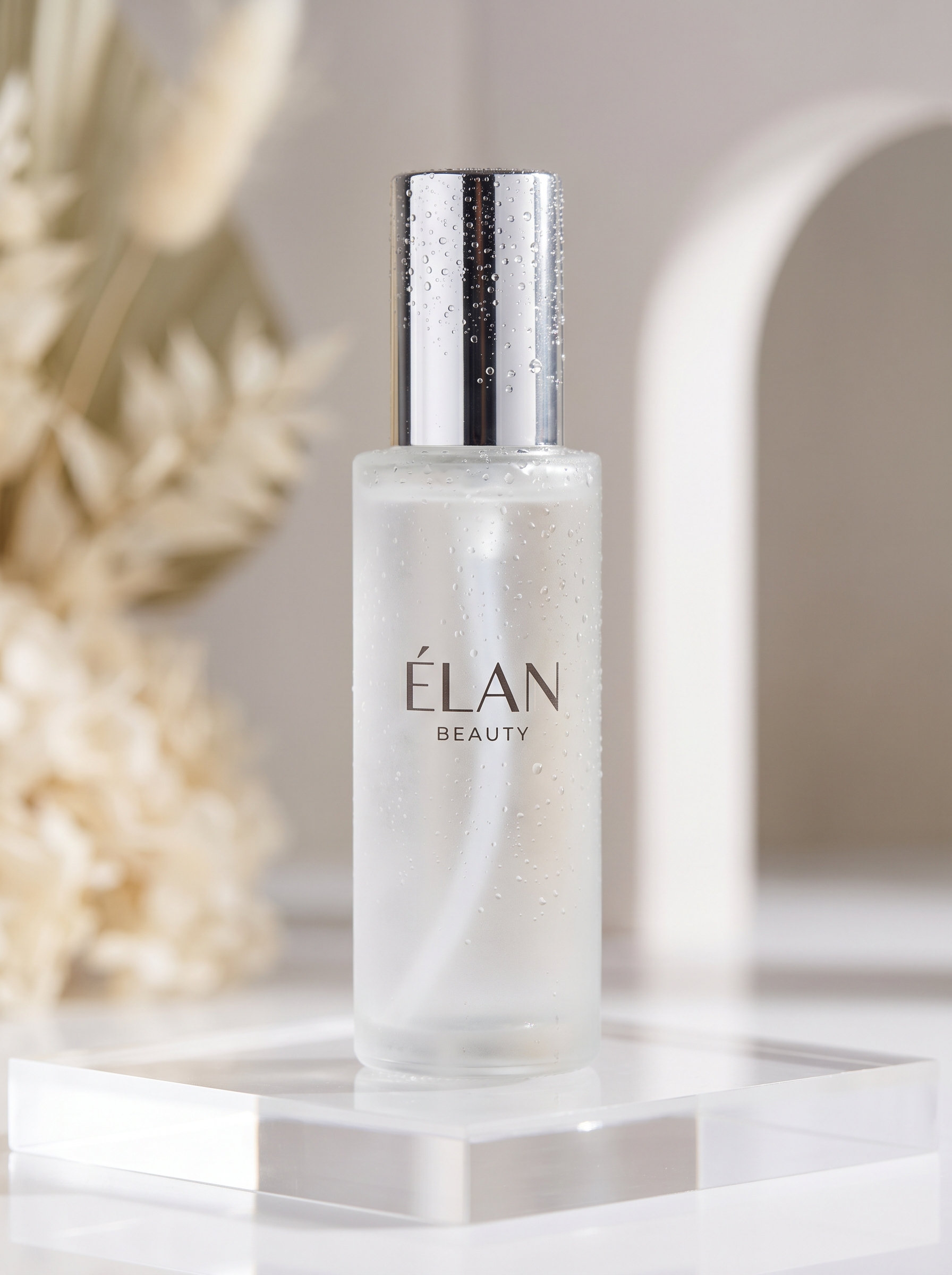 A skincare bottle surrounded by water droplets and reflections