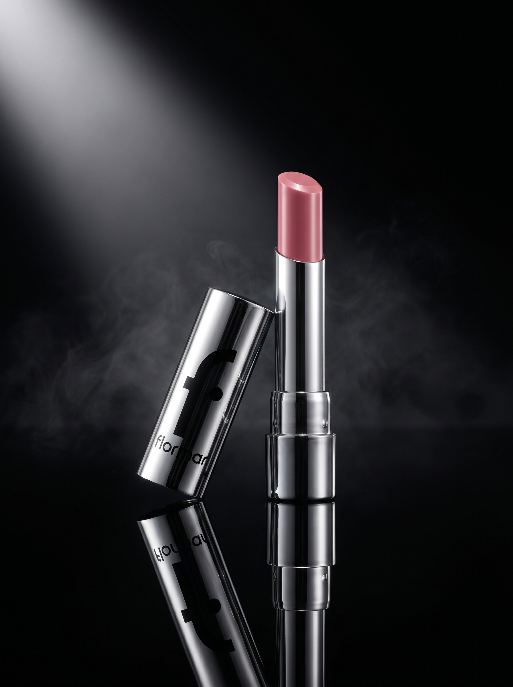 A lipstick standing in a spotlight with a smoke effect